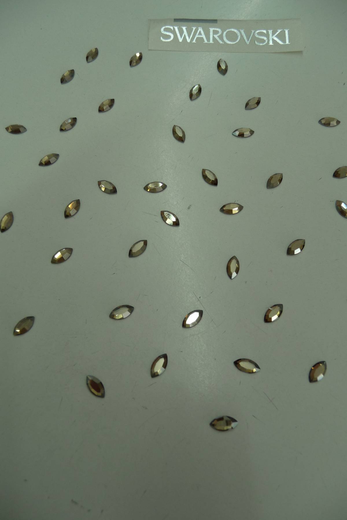 strass swarovski navetta 8x4 golden shadow (confezioni da 45 pezzi) Art STR8X4D